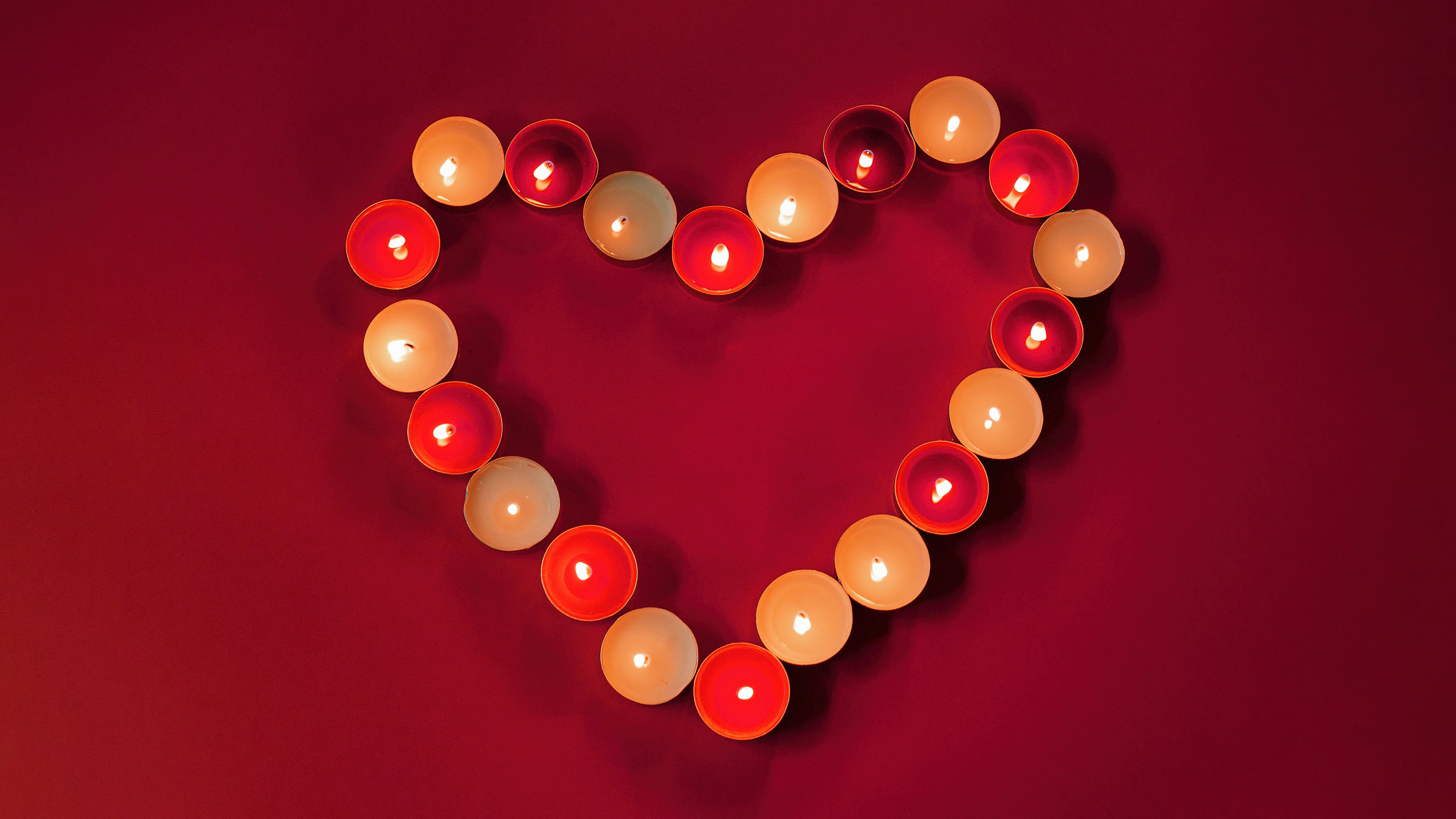 Candlelit Heart: Warmth in Red 4K 5K Wallpaper