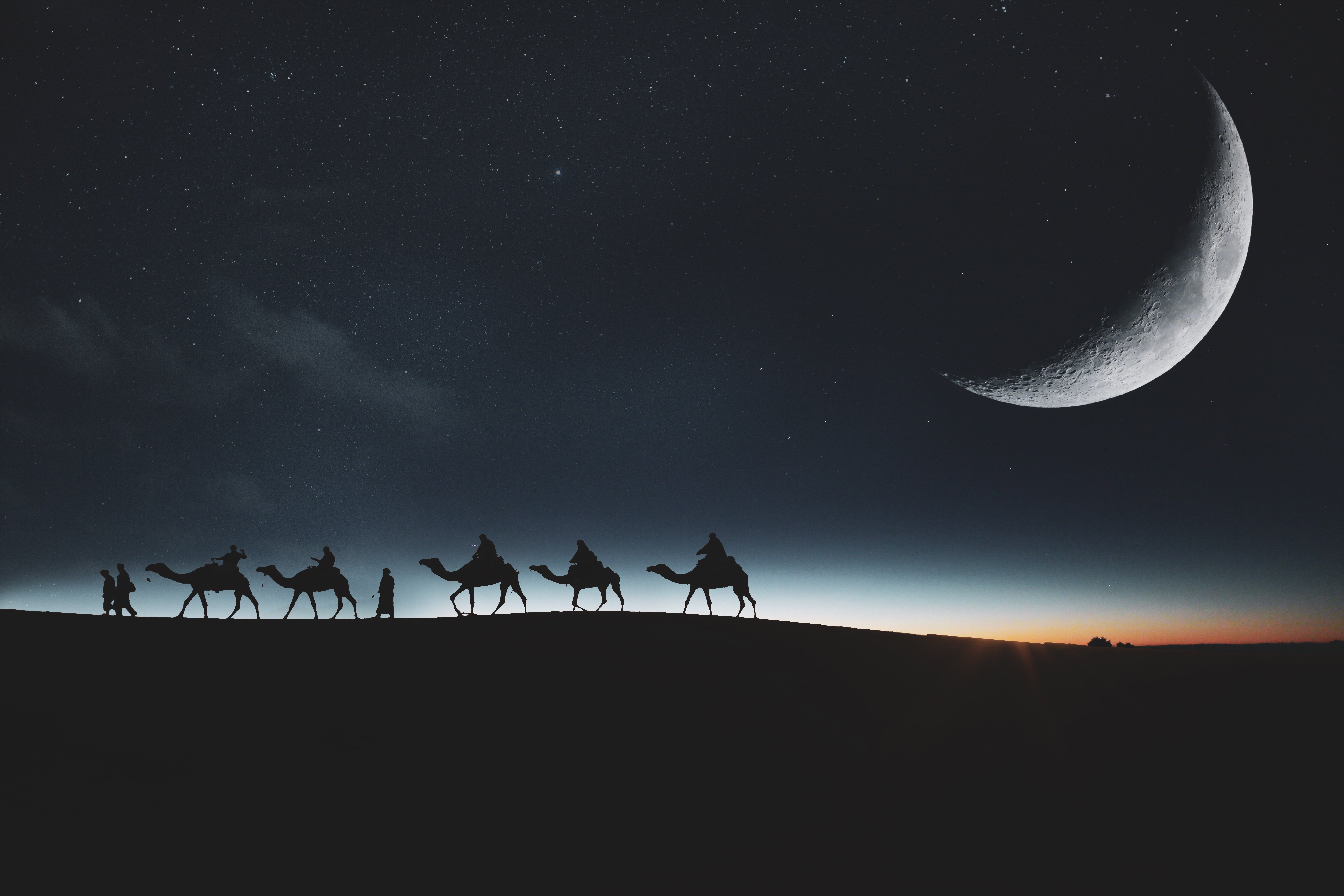 Desert Caravan Under Crescent Moon 4K 5K Wallpaper