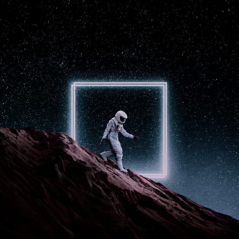 Astronaut's Glowing Portal to Infinity Wallpaper