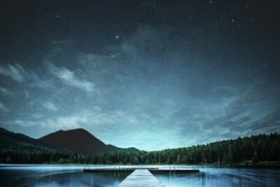 Starlit Jetty Over Tranquil Mountain Lake 4K 5K Wallpaper