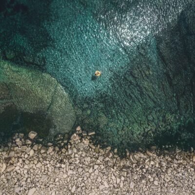 Rocky Shore's Aerial Perspective Wallpaper