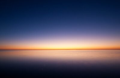 Serene Sunset Over Tranquil Ocean Wallpaper