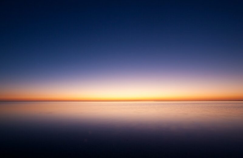 Serene Sunset Over Tranquil Ocean Wallpaper