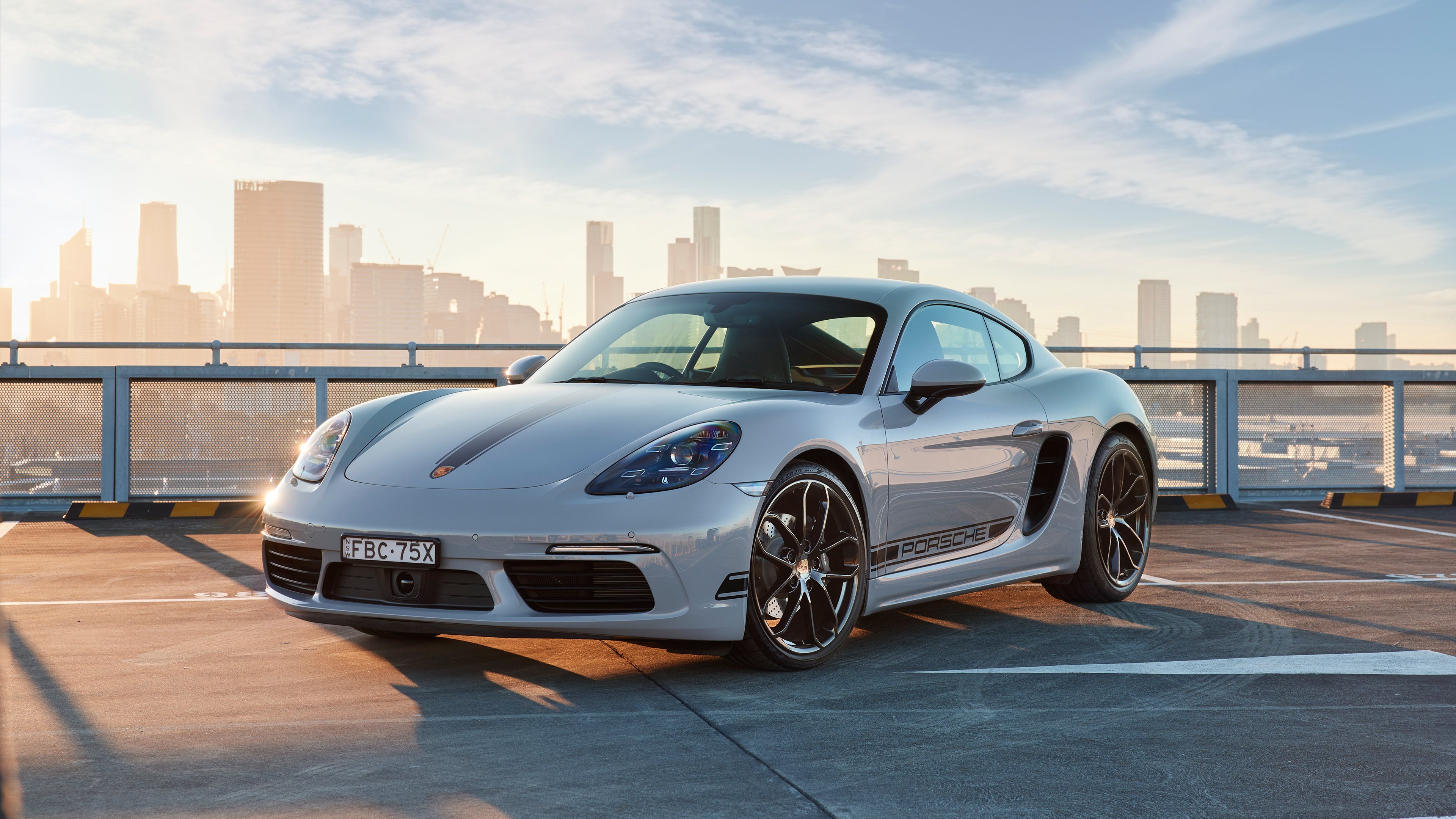 Sleek 2023 Porsche 718 Cayman on Urban Rooftop 4K Wallpaper