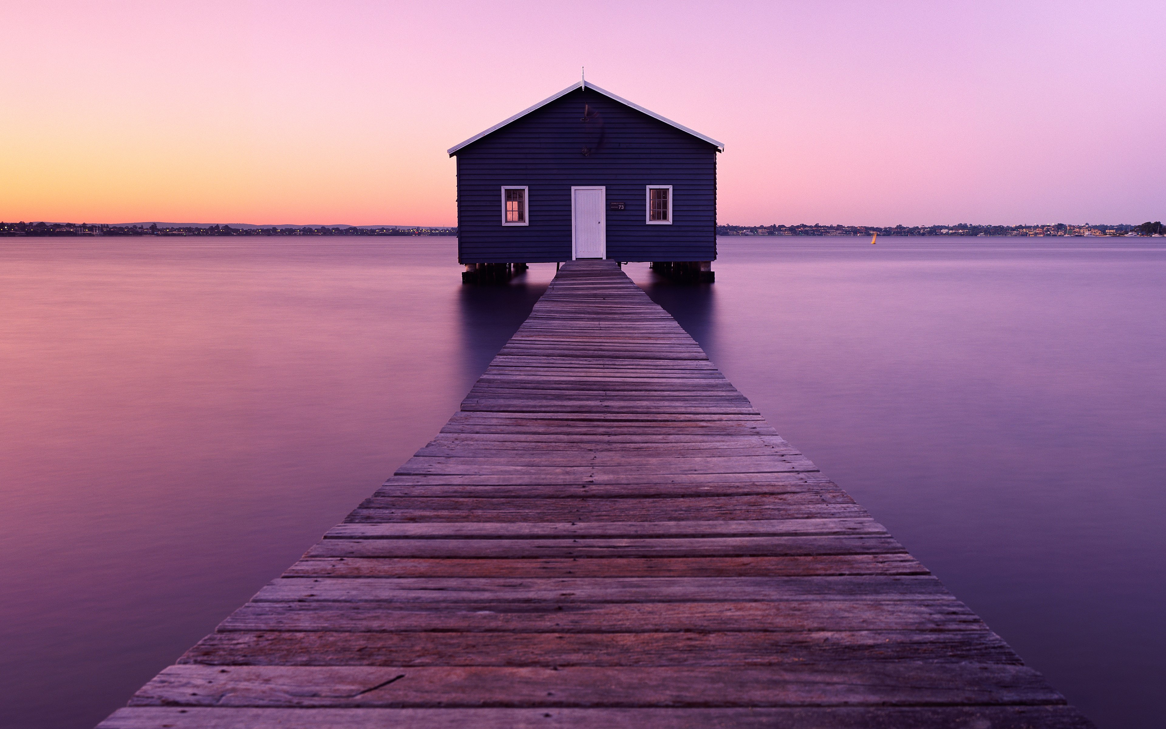 Solitude at Dawn: Riverside Boathouse 4K Wallpaper