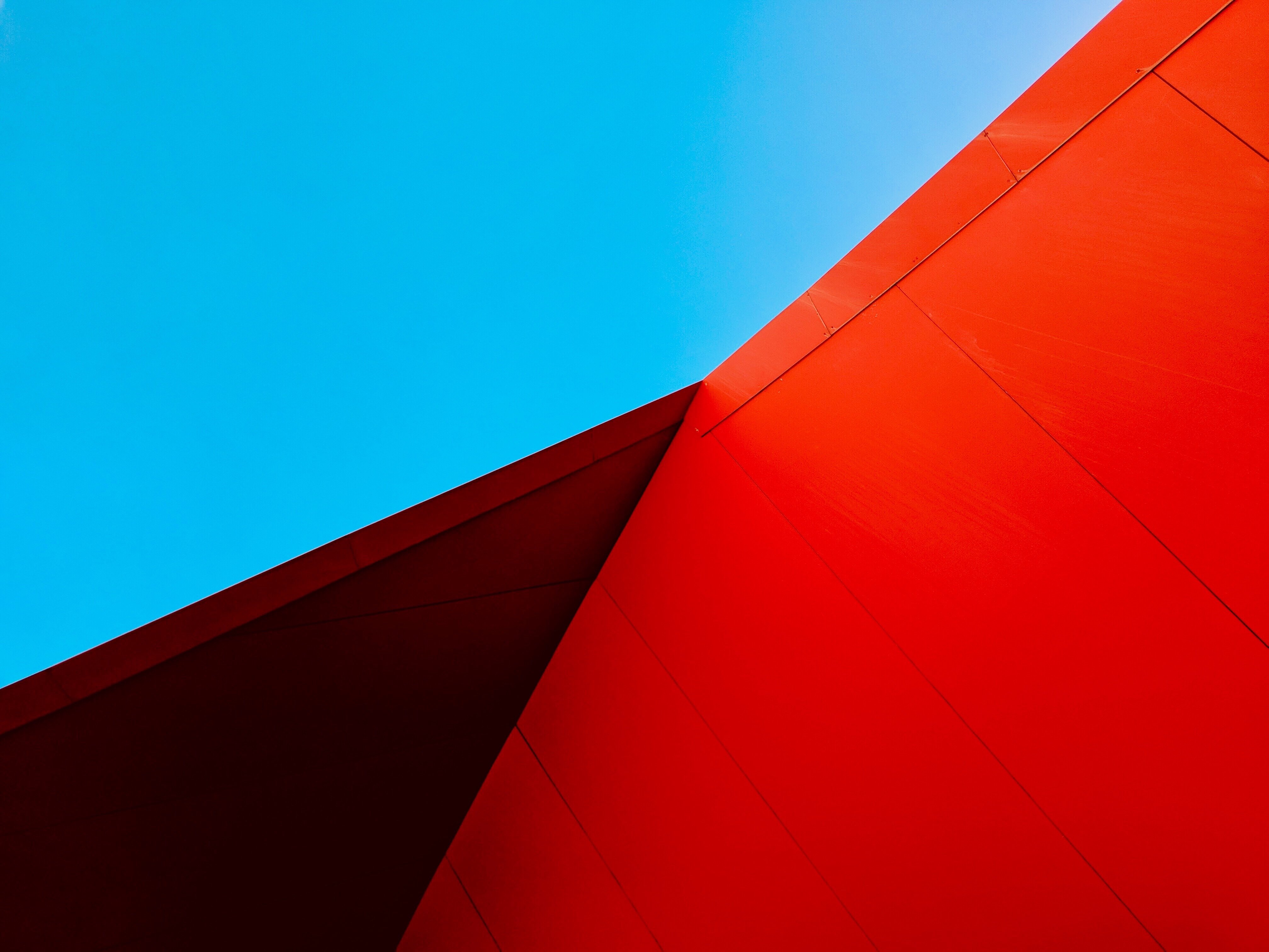 Modern Lines: Blue & Red Architecture 4K Wallpaper
