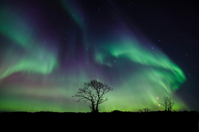 Aurora's Ethereal Dance in Night Sky 4K 5K Wallpaper