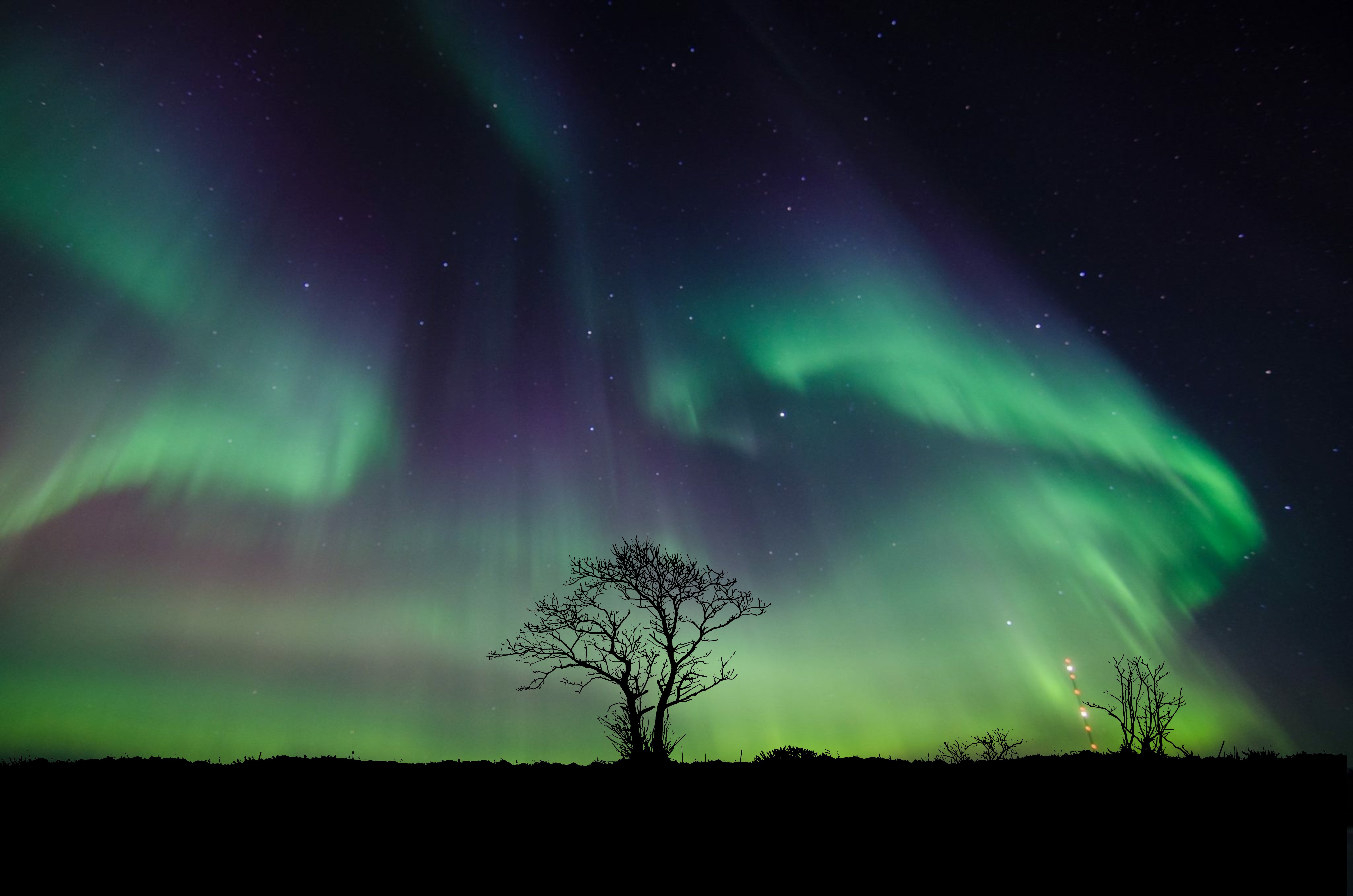 Aurora's Ethereal Dance in Night Sky 4K 5K Wallpaper