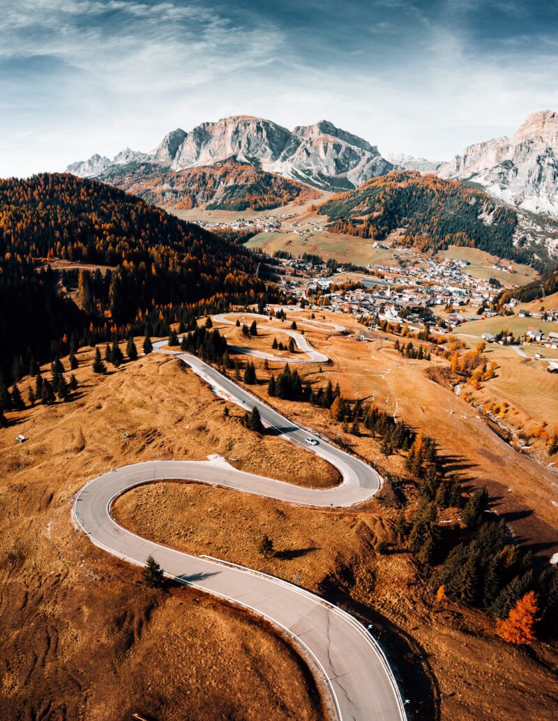 Dolomites: Winding Road Through Autumn Magic Wallpaper